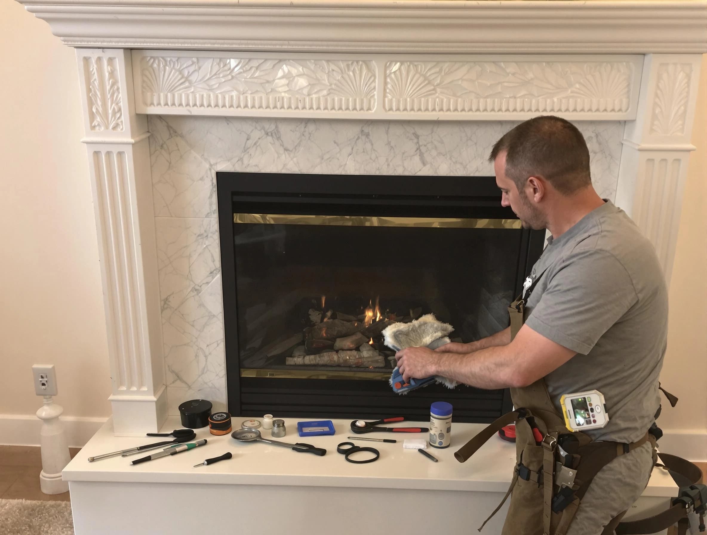 Stoughton Chimney Sweep performing fireplace maintenance in Stoughton, MA