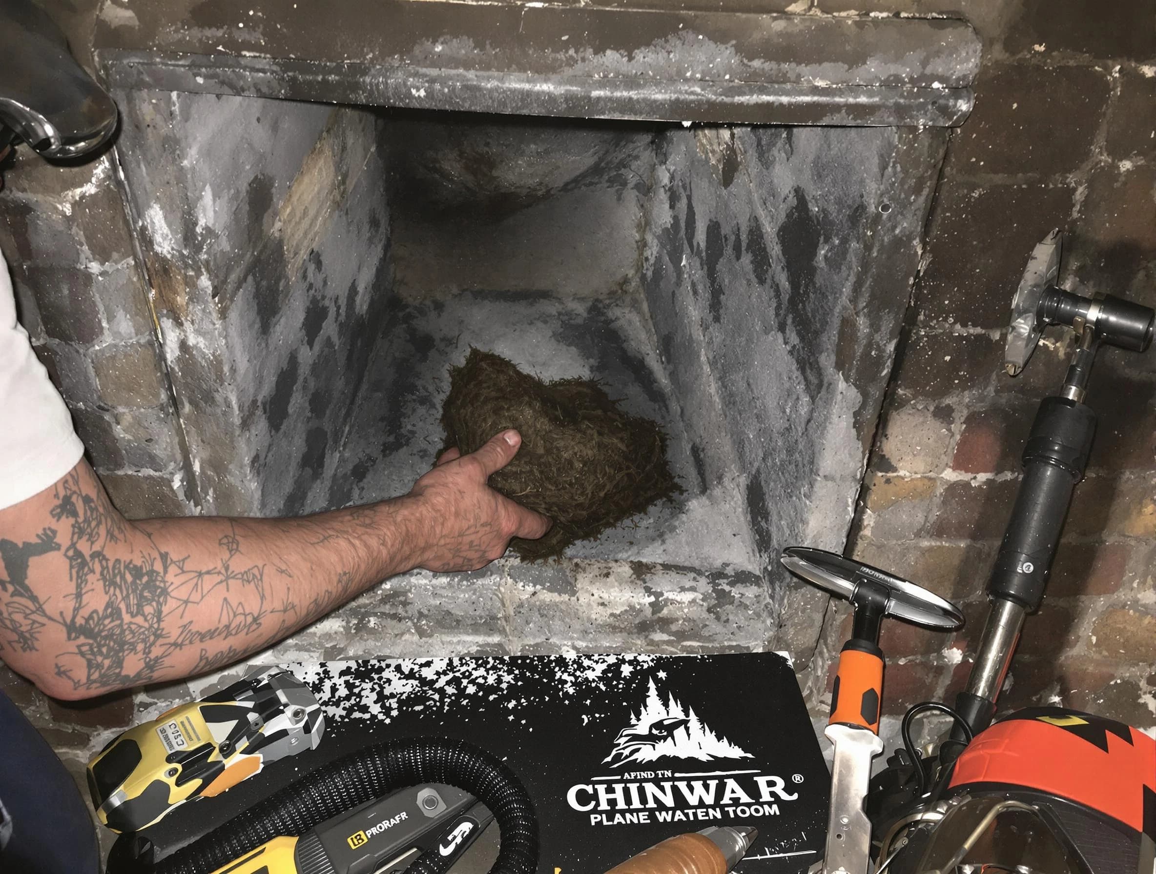 Stoughton Chimney Sweep safely removing debris and screening chimney in Stoughton, MA